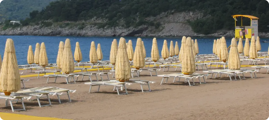 Beach with deck chairs and umbrellas